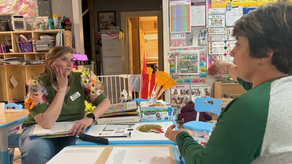 4-C staff talks with a family child care provider about the Child and Adult Food Program as her CACFP sponsor.